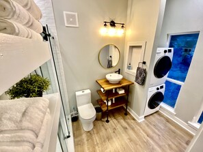 Shower, towels, soap, toilet paper