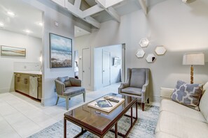 Relax in this inviting living space with comfortable seating and a serene view.