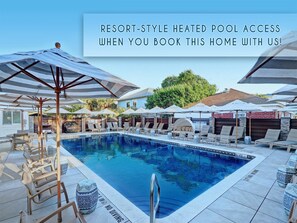Relax by the resort's heated pool surrounded by lounge chairs and umbrellas.