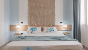 A neatly arranged bedroom with a bed, two bedside lamps, a macramé wall hanging, and a woven basket on the floor.