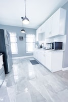 Casa Signature | Cocina privada | Frigorífico, microondas, horno y cafetera o tetera