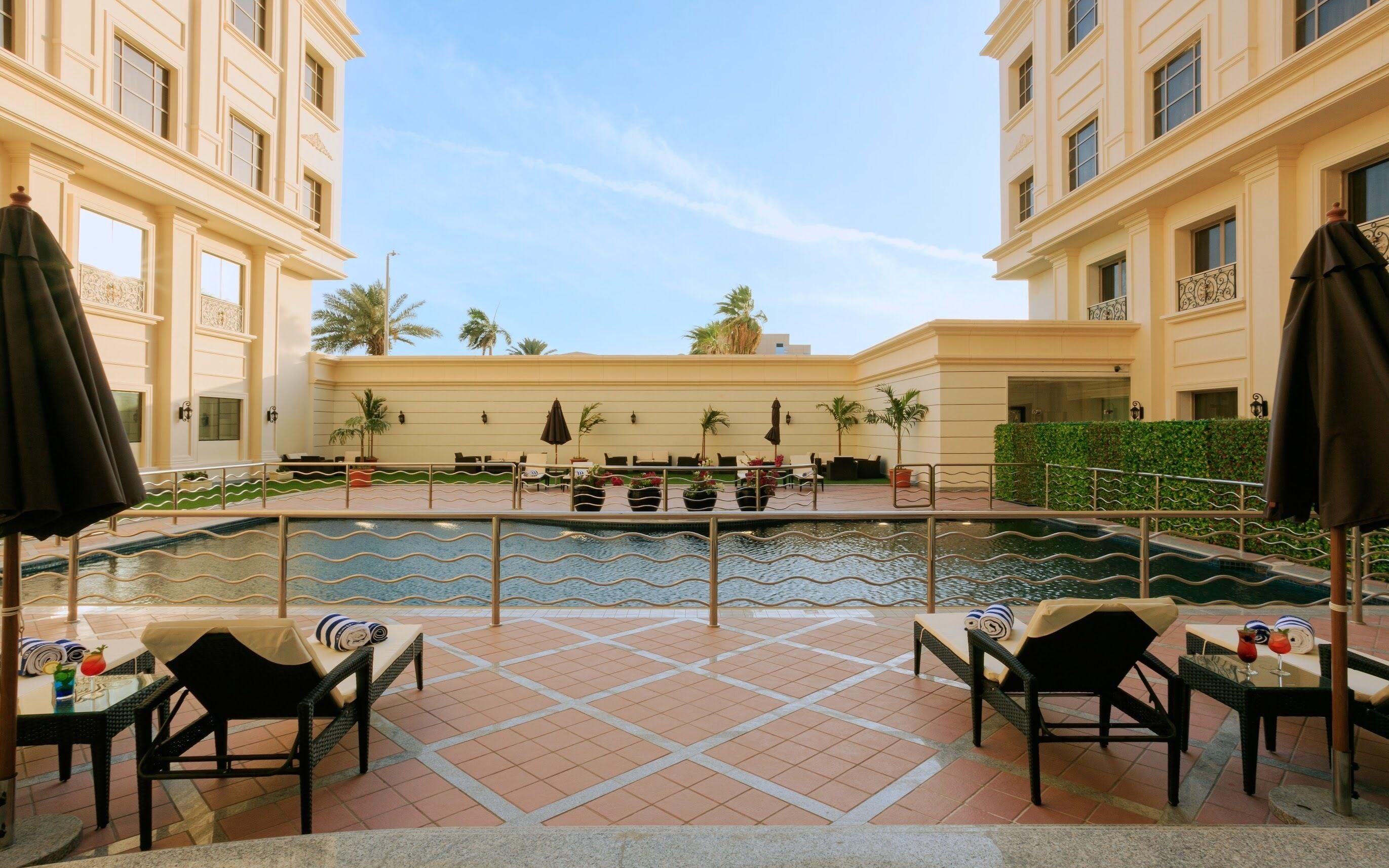 Outdoor pool, open 7:00 AM to 5:00 PM, pool umbrellas, sun loungers