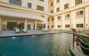 Outdoor pool, open 7:00 AM to 5:00 PM, pool umbrellas, pool loungers