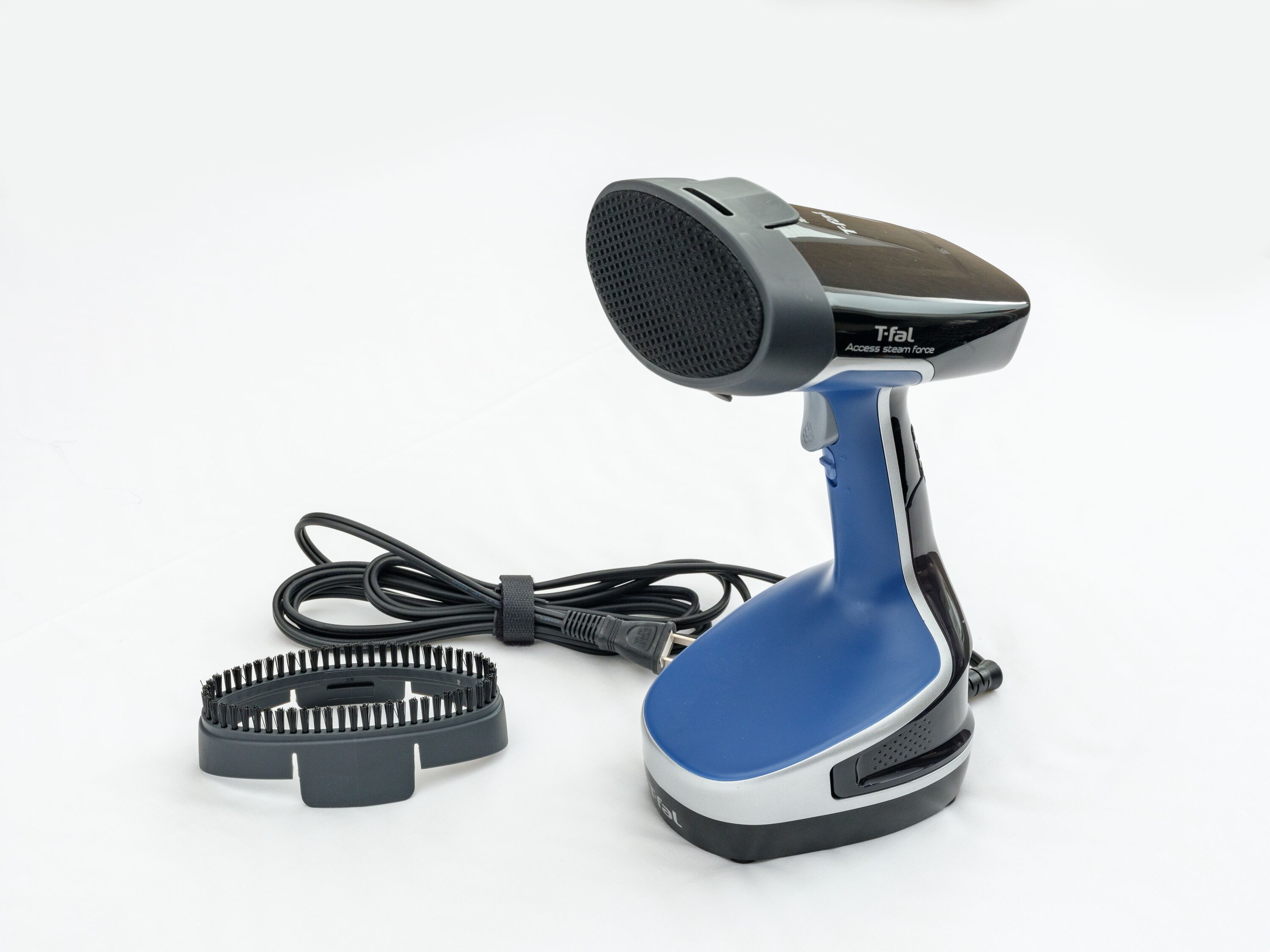 A blue and black handheld steam cleaner with a cord and a circular brush attachment.