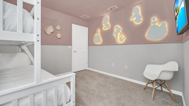 A child's bedroom with bunk beds, a white chair, and wall art. - Your Beautiful 5 Star Villa Minutes From Disney on the Prestigious Windsor Island Resort, Orlando Villa 5566 (Kissimmee)