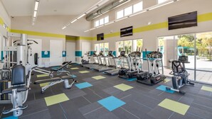 A gym with treadmills, elliptical machines, and weight equipment. - Amazing Villa on Veranda Palms Resort With Private Pool, Orlando Villa 5626 (Kissimmee)