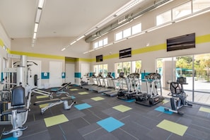 A gym with treadmills, elliptical machines, and weight equipment. - Luxury Villa on Veranda Palms Resort, Minutes From Disney World, Orlando Villa 5625 (Kissimmee)