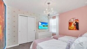 A bedroom with a bed, a dresser, a TV, and a painting on the wall. - Ultimate Luxury Getaway With 10 Bedrooms 5659 (Kissimmee)