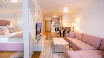 Apartamento standard, 1 cama King e sofá-cama | Área de estar