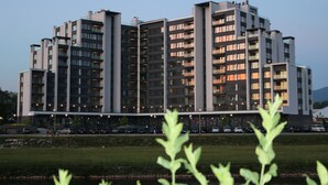 A multi-story residential building with a modern architectural design, featuring balconies and large windows. - River Walk Sarajevo (Sarajevo)