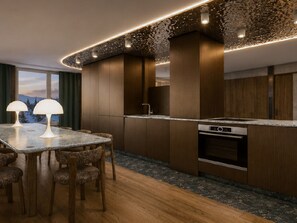 A modern kitchen with wooden cabinets, a granite countertop, and built-in appliances.