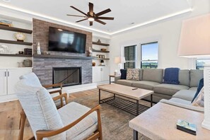 TV, fireplace - Water's Edge by Brunswick Vacation Rentals w/ Pool (Ocean Isle Beach)