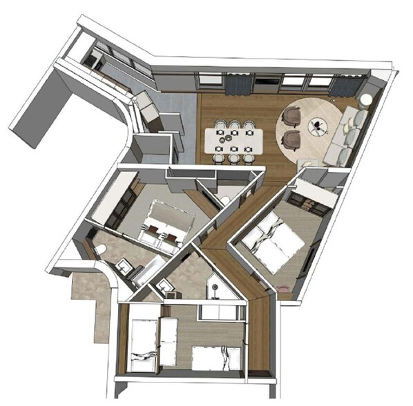 A floor plan of a hotel with a living area, dining space, and two bedrooms.