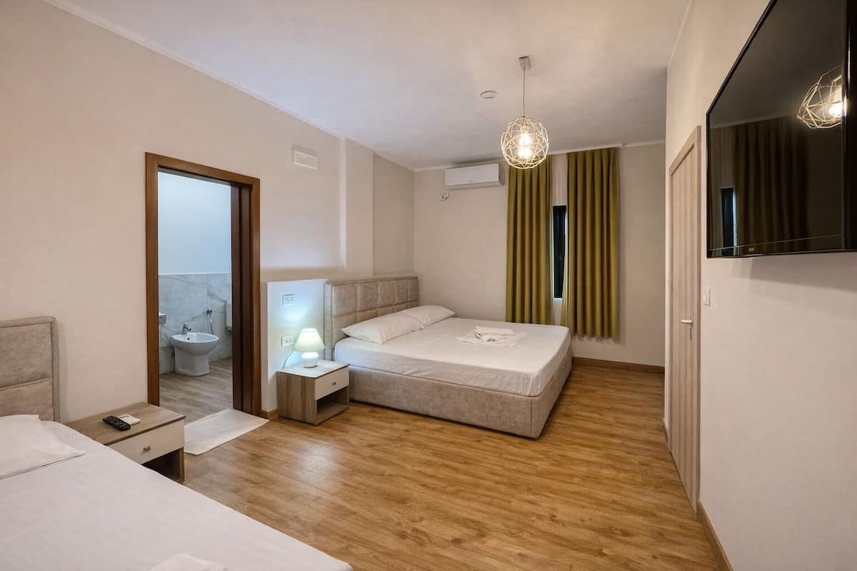 Spacious King + Single Room | Desk, laptop workspace, blackout drapes, WiFi (free)