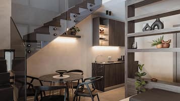 Deluxe-lejlighed | Opholdsområde | 55-tommers smart-tv med satellitkanaler, tv, pejs