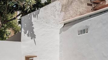 Outdoor pool, a heated pool, pool umbrellas, pool loungers