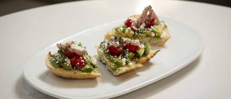 Three appetizers on a white plate.
