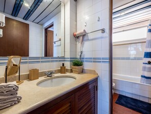 Bathtub, hair dryer, towels