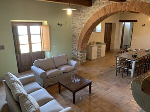 Deluxe Villa | Living area | 25-inch flat-screen TV with digital channels, TV, fireplace - Villa Gosparini (Lisciano Niccone)