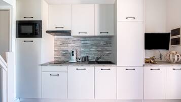 Fridge, microwave, coffee/tea maker, toaster