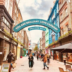 Welcome to Carney's, where vibrant streets and lively atmosphere await.