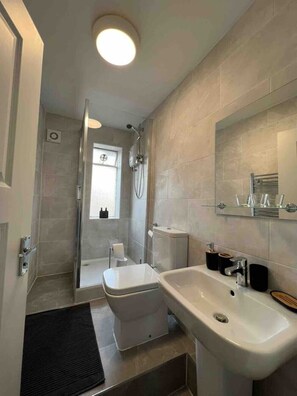 Shower, hair dryer, towels, soap