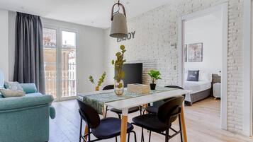 One-Bedroom Apartment with Balcony | Living area | Smart TV