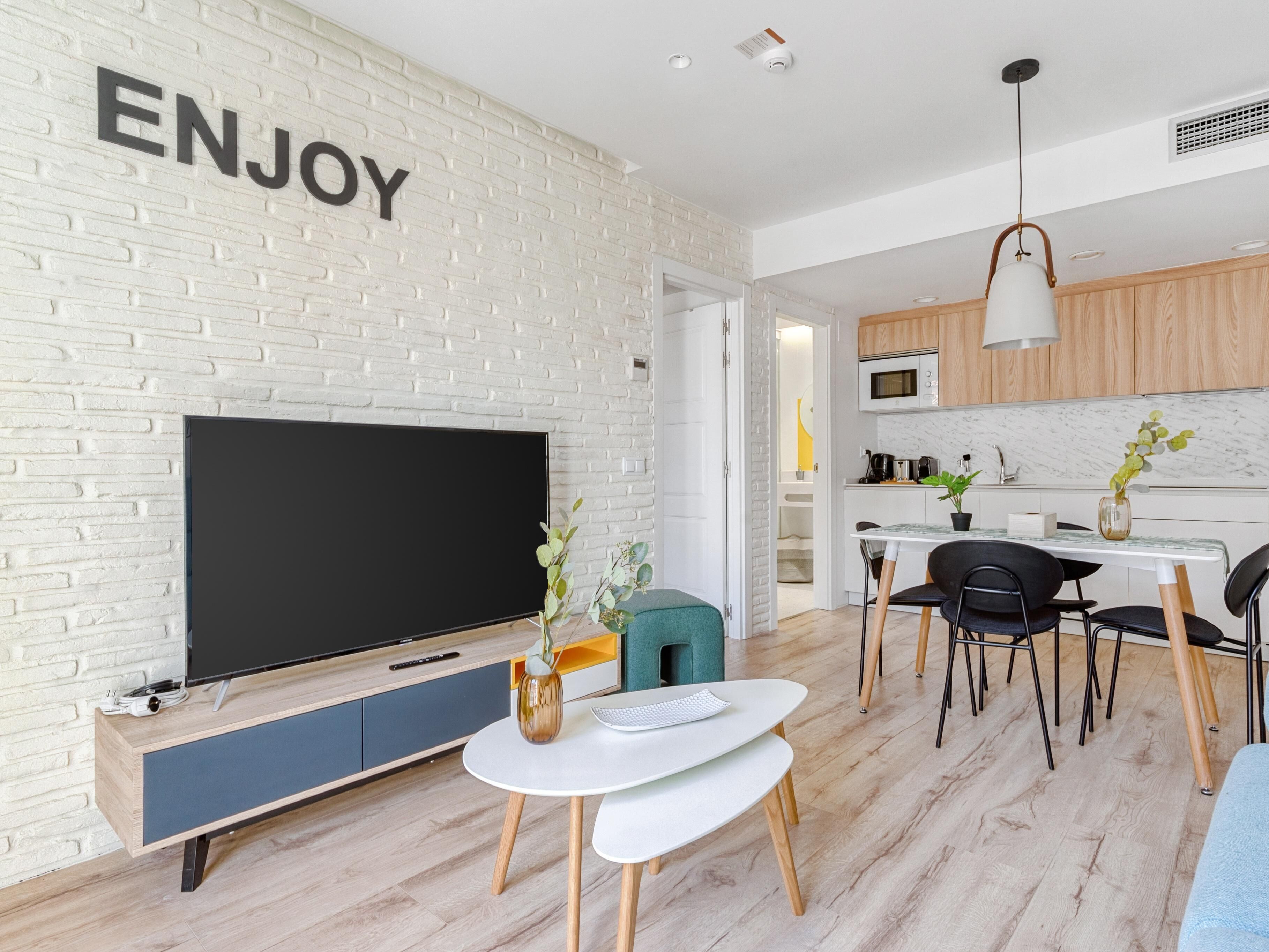One-Bedroom Apartment with Balcony | Living area | Smart TV