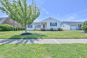 Welcome to this charming single-story home with a gabled roof and inviting front porch.