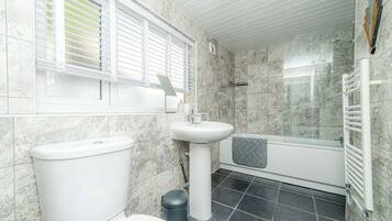 Combined shower/bathtub, hair dryer, towels, soap