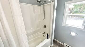 Combined shower/tub, hair dryer, towels, soap