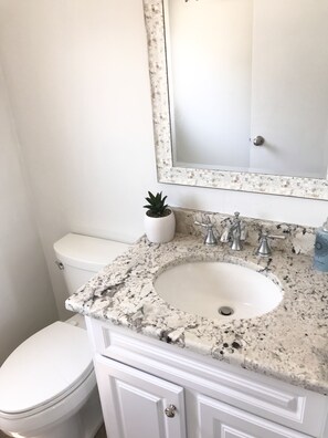 Combined shower/bathtub, hair dryer, towels, soap
