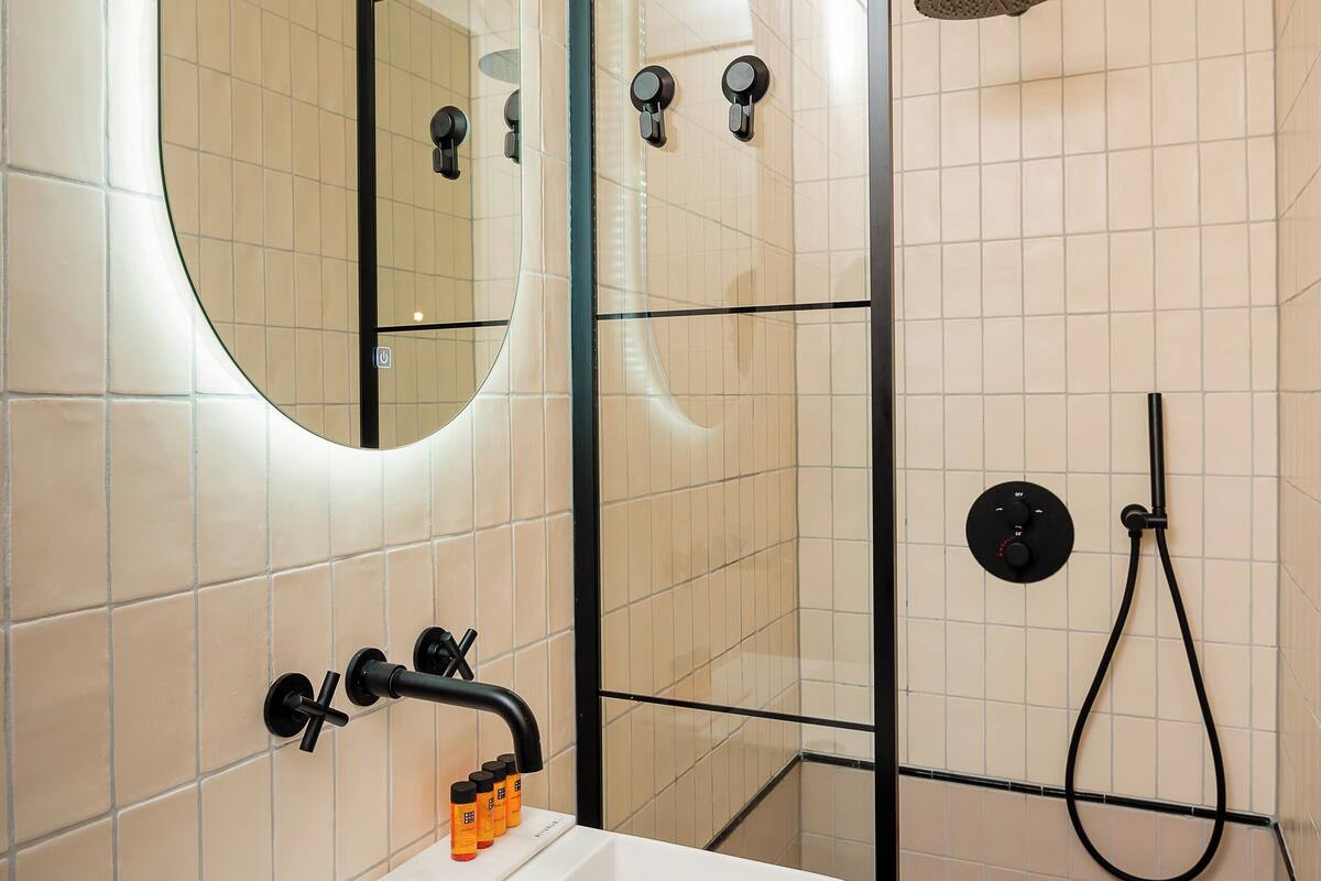 large room | bathroom | shower, free toiletries, hair dryer, towels