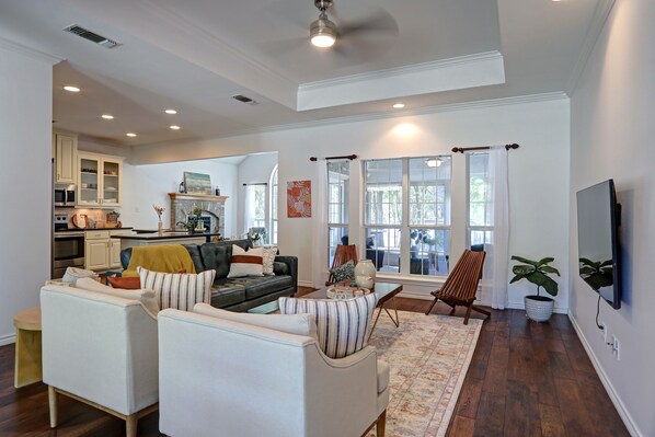 Smart TV, fireplace, books, computer monitors