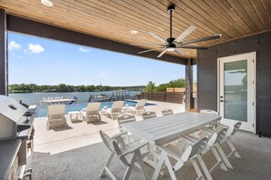 Outdoor dining - Waterhouse Lake LBJ Residence III, 6 King Beds, Pool, Spa, Boat/PWC Lift, Slide (Kingsland)