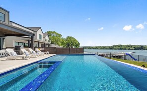 Outdoor pool, an infinity pool - Waterhouse Lake LBJ Residence III, 6 King Beds, Pool, Spa, Boat/PWC Lift, Slide (Kingsland)