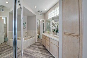 Combined shower/tub, hair dryer, towels, soap