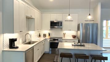 Premium Condo | Private kitchen | Fridge, coffee/tea maker, dining tables
