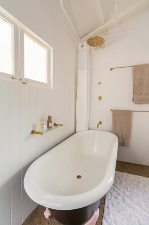 Combined shower/bathtub, towels, soap, toilet paper