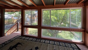 A room with large windows, a wooden ceiling, and a patterned rug. - Mid-Century Modern Gem next to Trails, Ski Resorts and Downtown Ogden (Ogden)