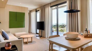 Signature Suite, 1 Bedroom, Sea View | Living room | 55-inch LED TV with satellite channels, TV, streaming services