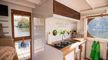 Fridge, stovetop, coffee/tea maker, cookware/dishes/utensils