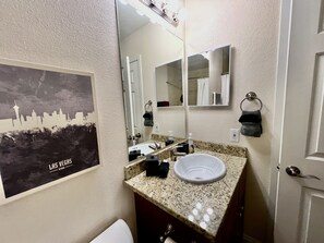 Combined shower/tub, hair dryer, towels, soap