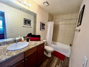 Combined shower/tub, hair dryer, towels, soap