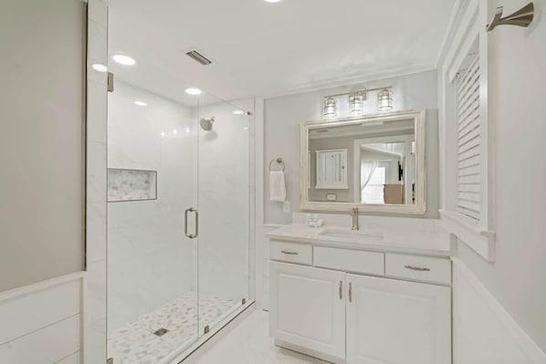 Shower, hair dryer, towels, shampoo