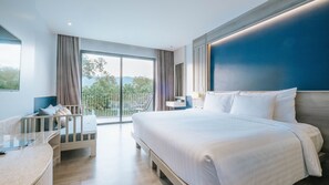 Deluxe Pool View Room | Minibar, in-room safe, desk, laptop workspace - Seabed Grand Hotel Phuket (Wichit)