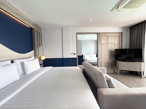 Family Room | Minibar, in-room safe, desk, laptop workspace - Seabed Grand Hotel Phuket (Wichit)