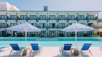 Outdoor pool, open 8:00 AM to 10:00 PM, pool umbrellas, pool loungers