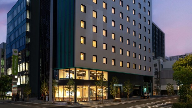 A modern hotel building with a prominent sign reading "PRINCE SMART INN" at the top. - Prince Smart Inn Hakata (Fukuoka)