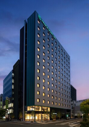 A modern hotel building with a prominent sign reading "PRINCE SMART INN" at the top. - Prince Smart Inn Hakata (Fukuoka)